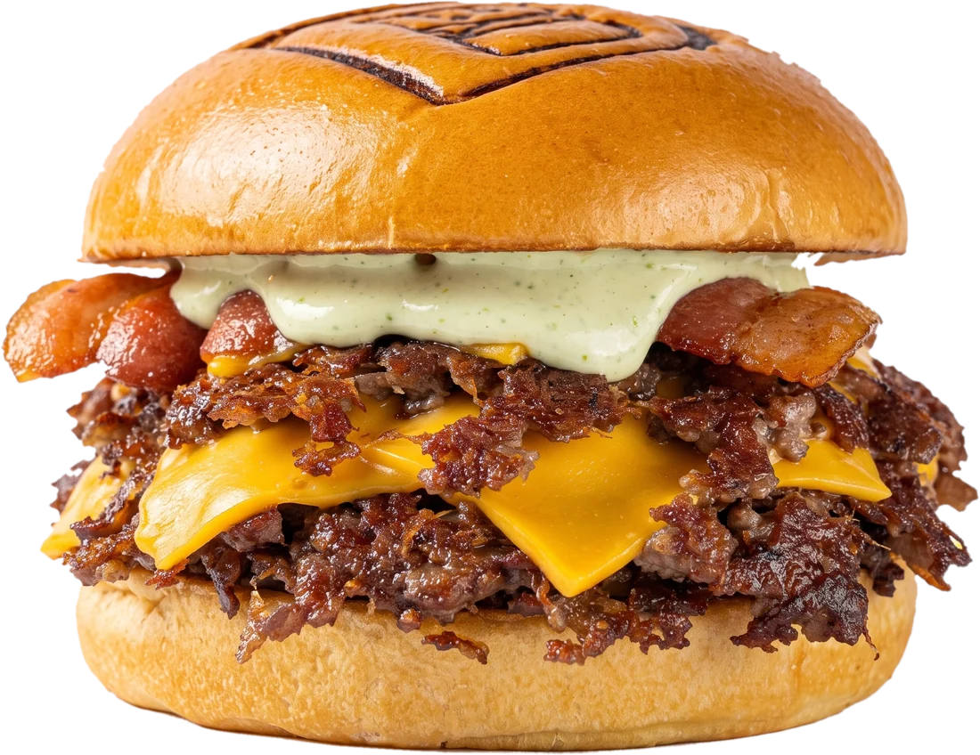 Smash burger de Dano's con doble Angus, cheddar derretido, panceta y mayonesa verde en el brioche marcado con la D